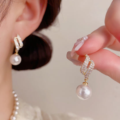 珍珠天使耳墜－商品主圖｜https://igowo.tw/