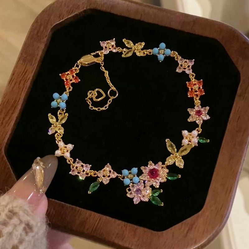 金色鋯石花朵電鍍耳環－商品主圖｜https://igowo.tw/