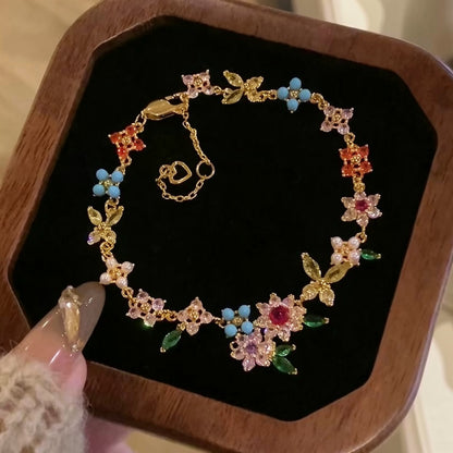金色鋯石花朵電鍍耳環－商品主圖｜https://igowo.tw/