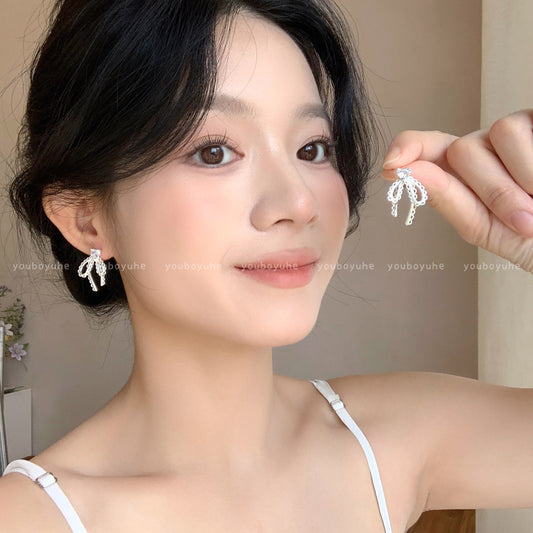 珍珠蕾絲蝴蝶結耳環－商品主圖｜https://igowo.tw/