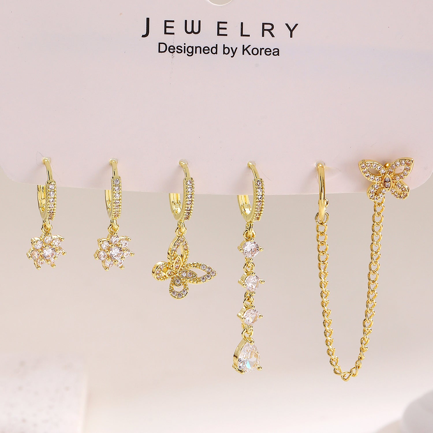 鋯石蝴蝶花朵微鑲耳環－商品主圖｜https://igowo.tw/