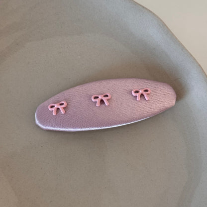 粉色布面蝴蝶結髮夾