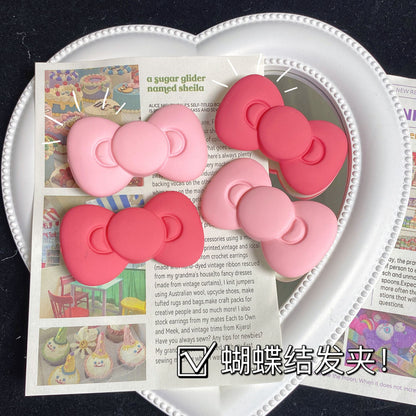 粉色蝴蝶結卡通髮夾－商品主圖｜https://igowo.tw/