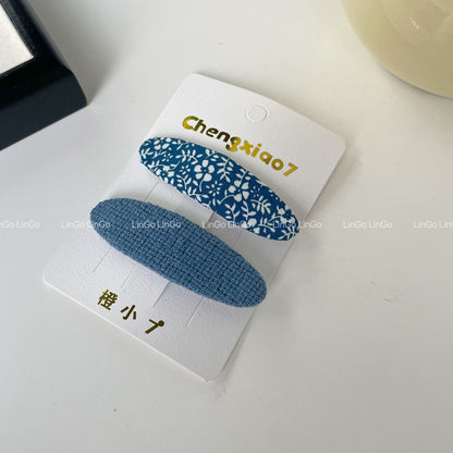 藍色碎花刺繡簡約髮夾－蘭花扎染細橢圓款細節｜https://igowo.tw/