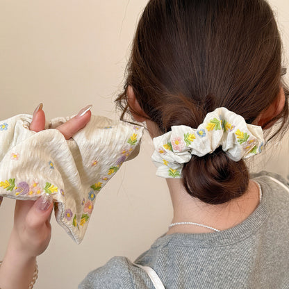 大腸圈花朵刺繡髮圈－商品主圖｜https://igowo.tw/