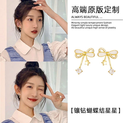 星星蝴蝶結鑲鑽耳釘－商品主圖｜https://igowo.tw/