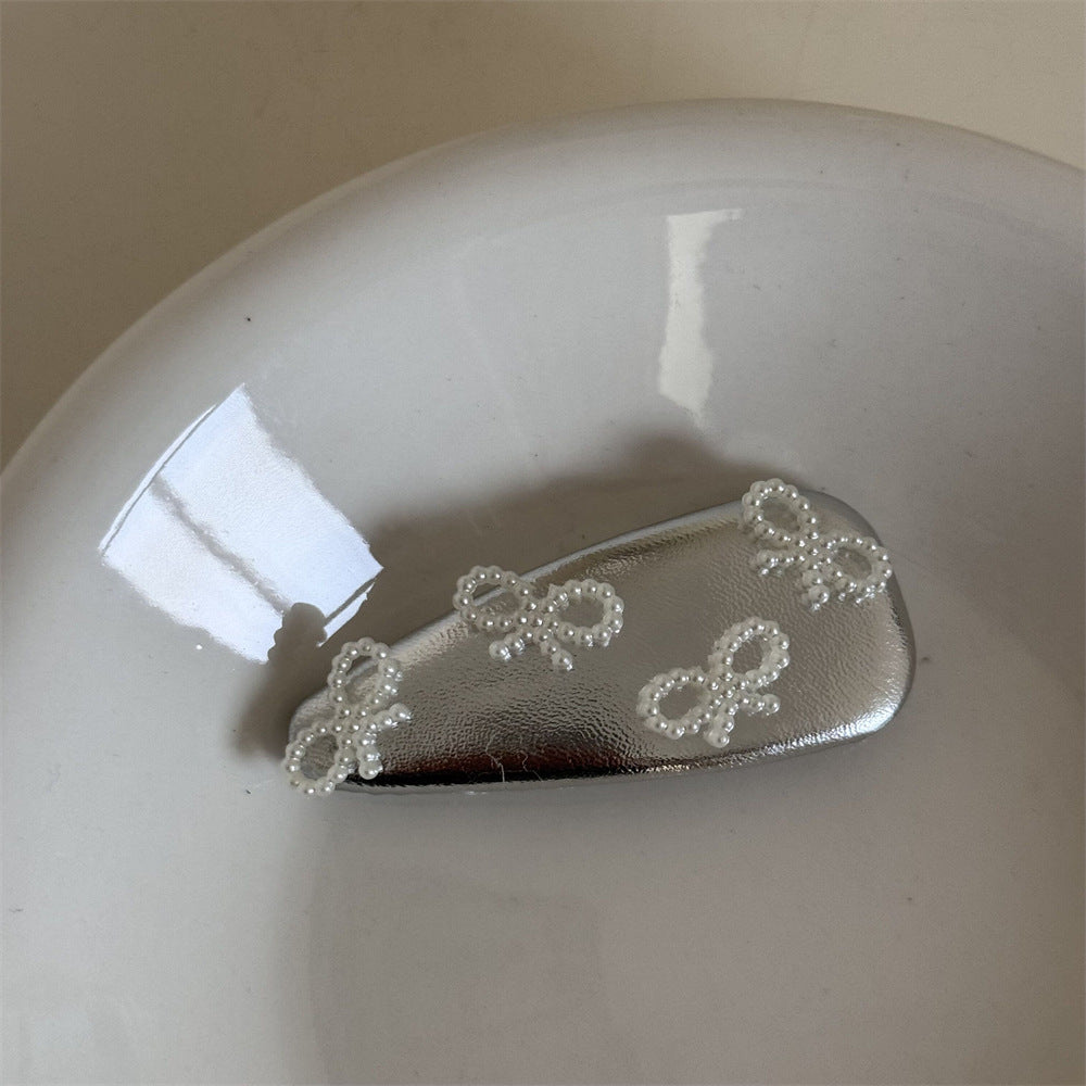 珍珠皮革蝴蝶結髮夾