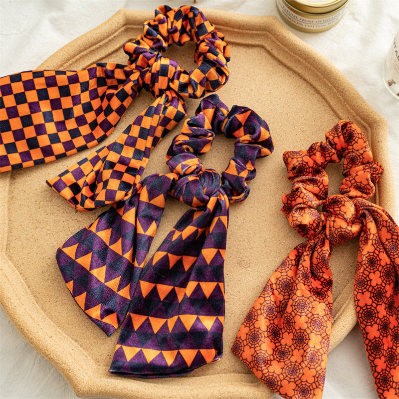 彈力繩蝙蝠星星髮圈－黃色條紋飄帶款細節｜https://igowo.tw/