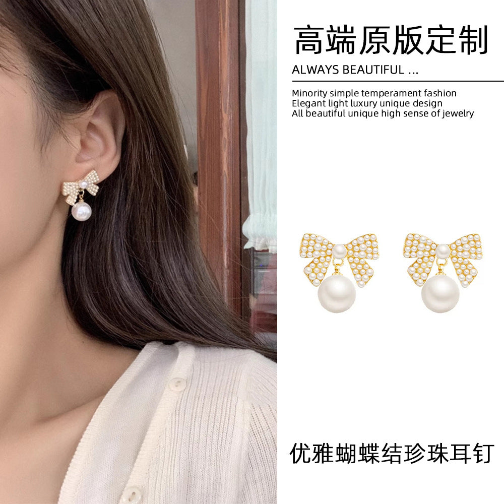 珍珠銀針蝴蝶結耳釘－商品主圖｜https://igowo.tw/