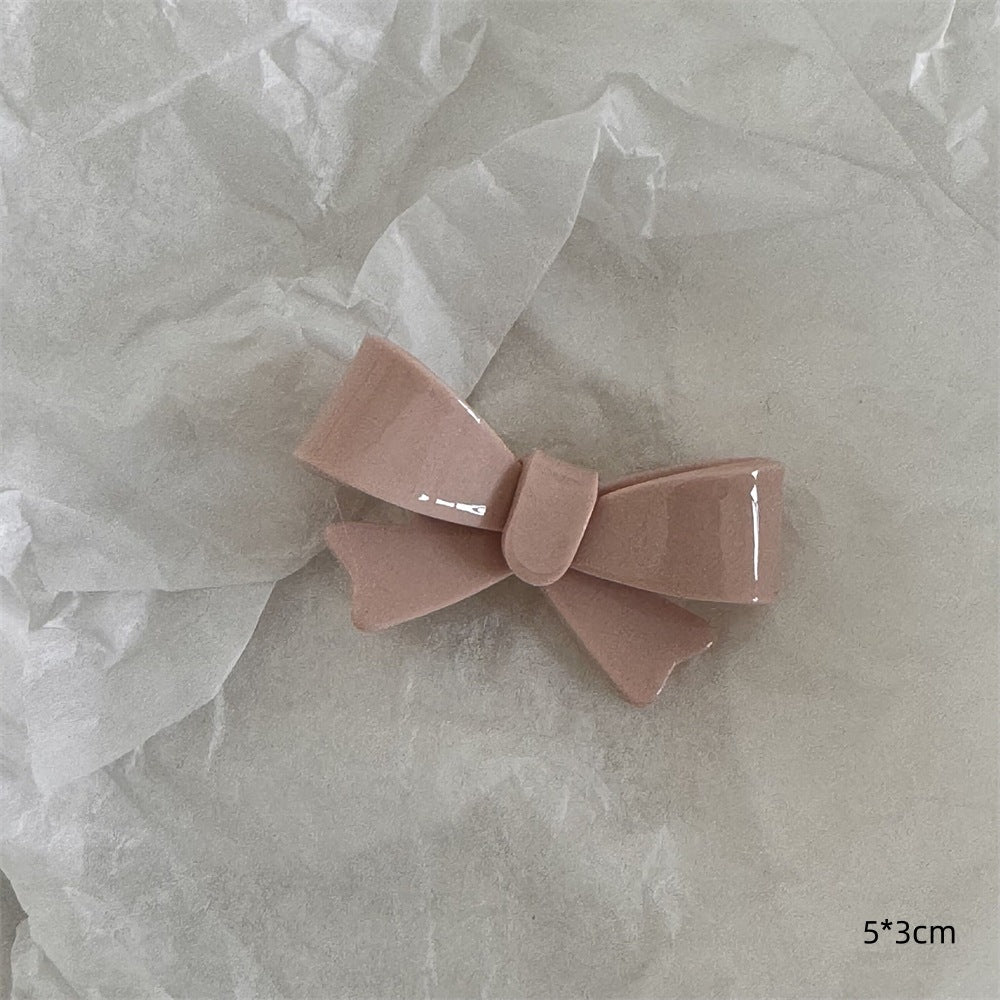粉色蝴蝶結髮夾－粉奶油-蝴蝶結款細節｜https://igowo.tw/