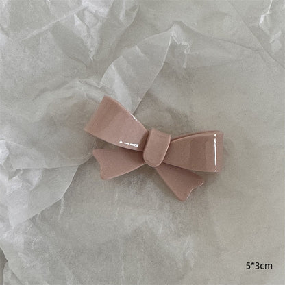 粉色蝴蝶結髮夾－粉奶油-蝴蝶結款細節｜https://igowo.tw/