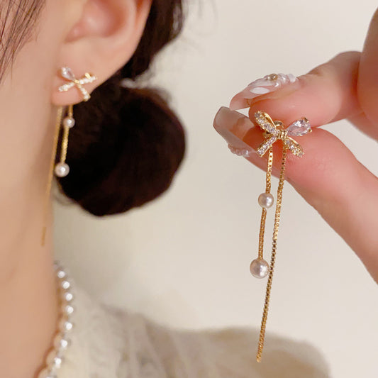 珍珠蝴蝶結流蘇耳墜－商品主圖｜https://igowo.tw/