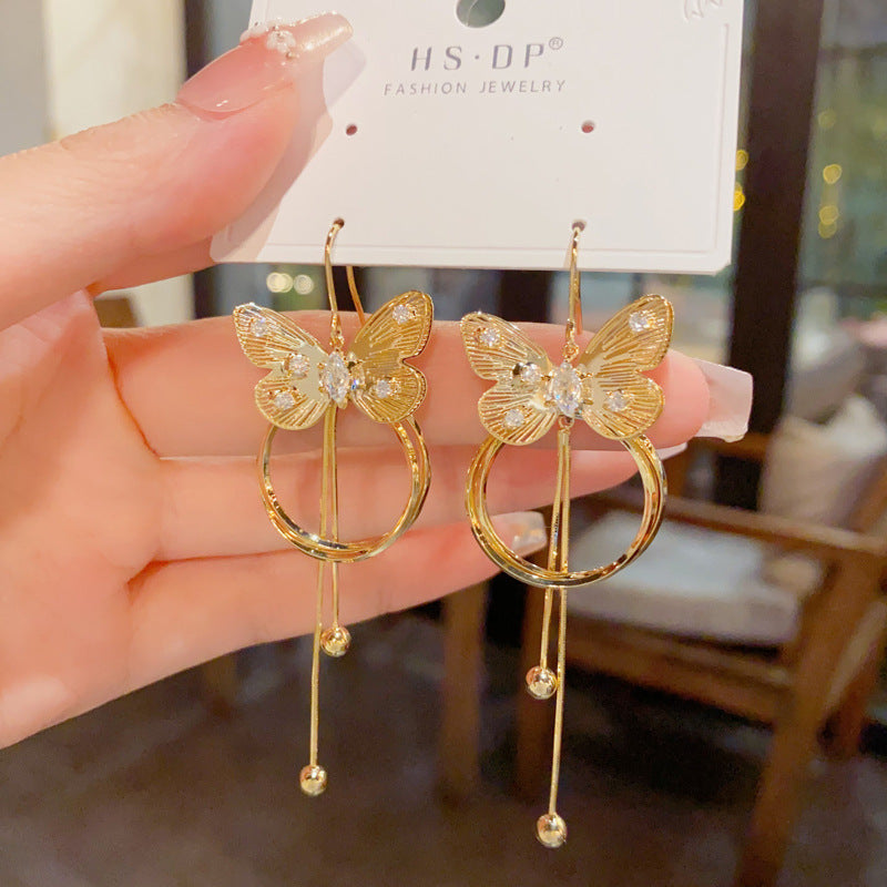 金屬蝴蝶圓圈流蘇耳墜－商品主圖｜https://igowo.tw/