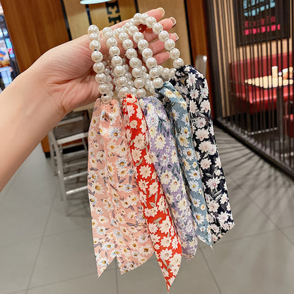 珍珠豹紋蝴蝶結髮圈－商品主圖｜https://igowo.tw/