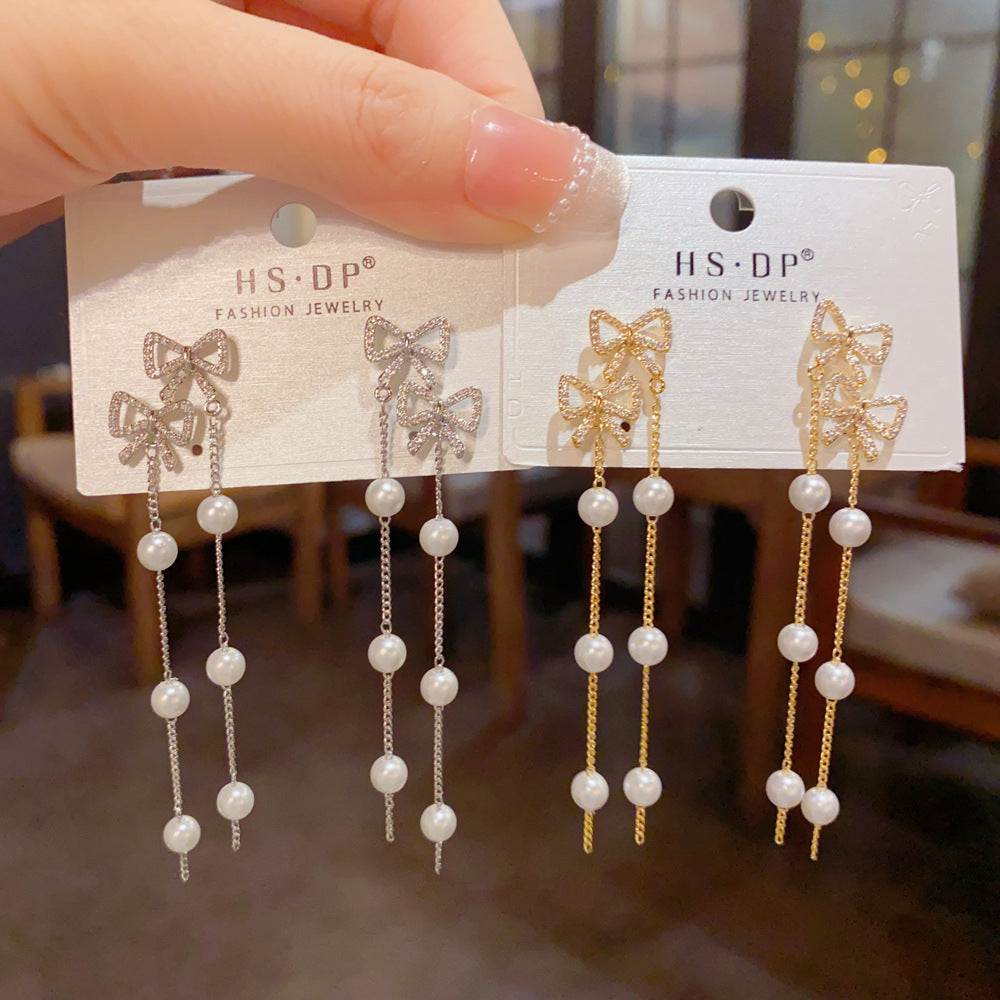 珍珠蝴蝶結流蘇耳環－商品主圖｜https://igowo.tw/