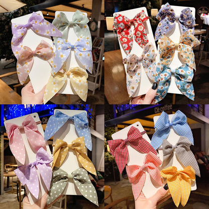 緞帶布面蝴蝶結髮圈－商品主圖｜https://igowo.tw/