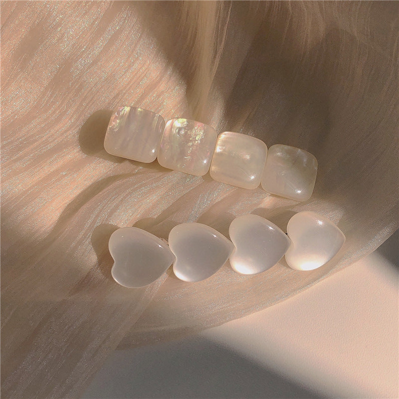 貓眼石愛心簡約髮夾－商品主圖｜https://igowo.tw/