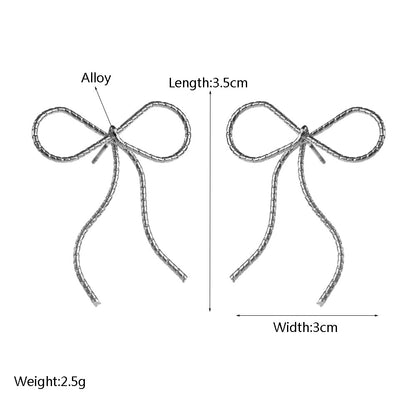 金屬蝴蝶結鏤空耳釘－光面蝴蝶結-銀款實拍｜https://igowo.tw/