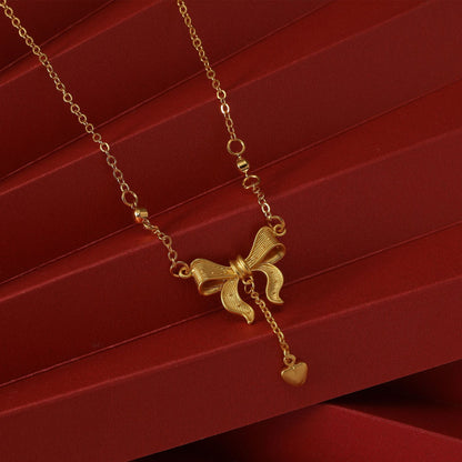 金色蝴蝶結流蘇項鍊－細節特寫1｜https://igowo.tw/