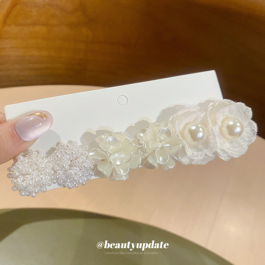 珍珠銀針花朵鑲鑽耳釘－細節特寫37｜https://igowo.tw/