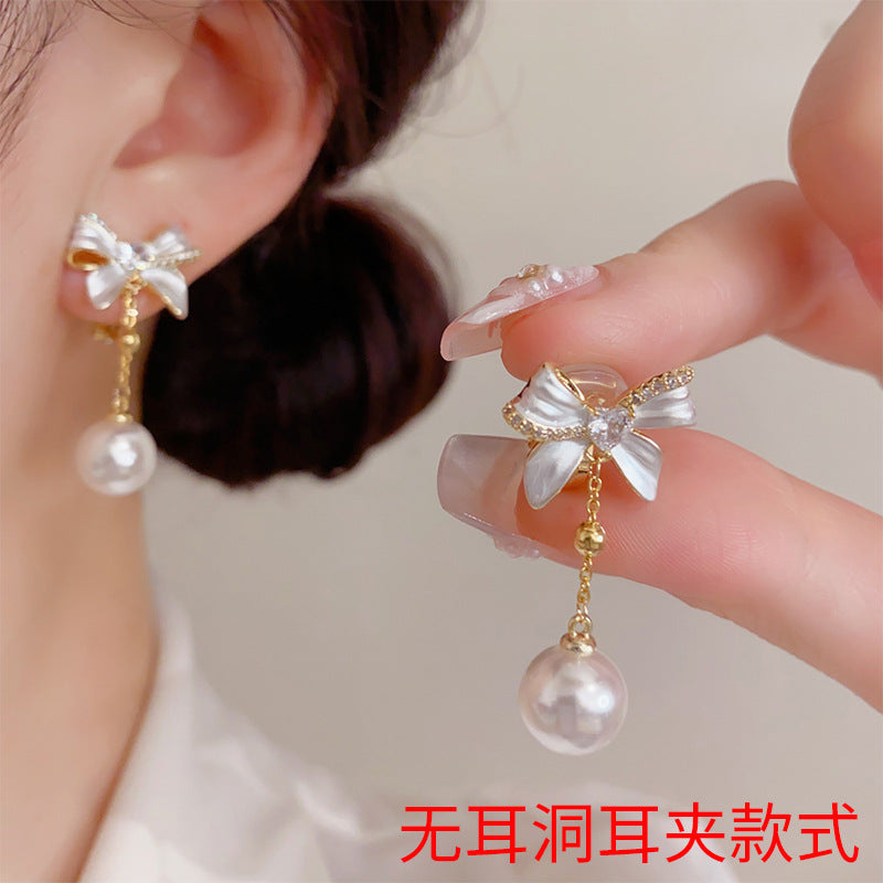 珍珠蝴蝶結流蘇耳夾－商品主圖｜https://igowo.tw/