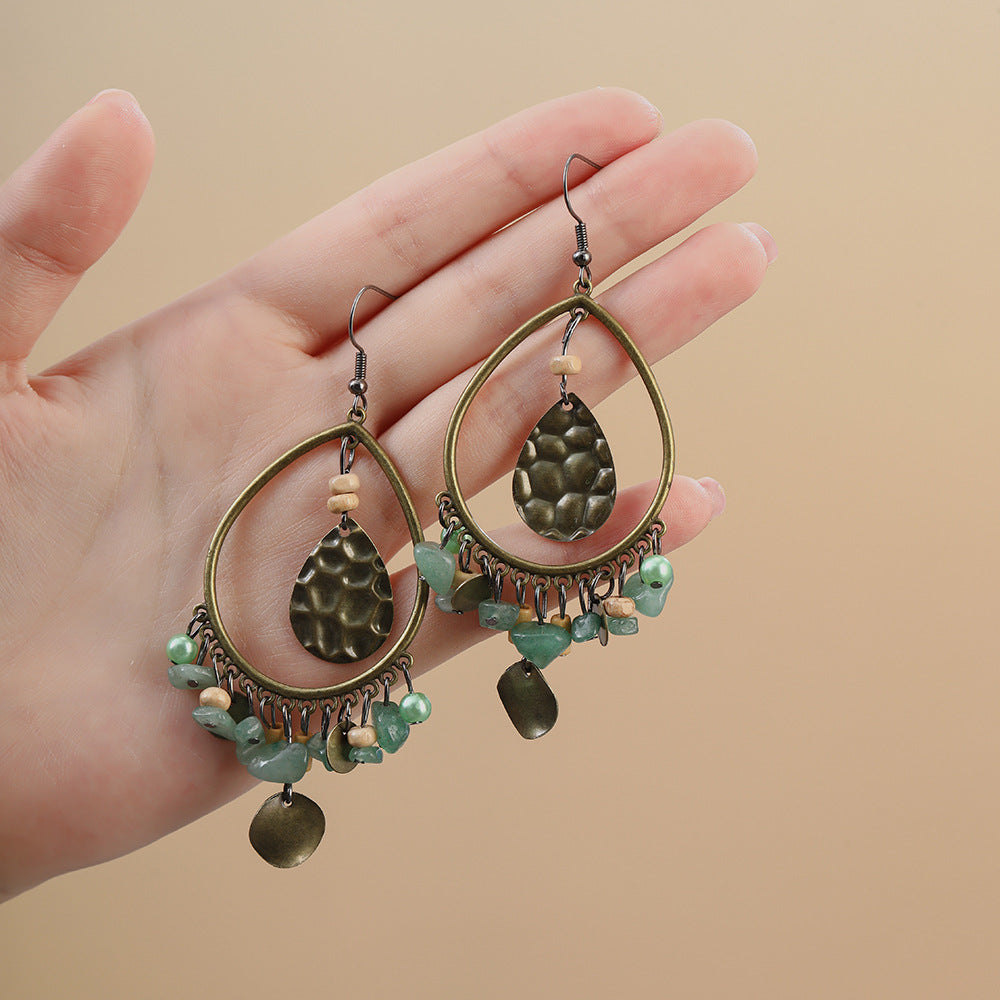 水滴流蘇鏤空耳環－商品主圖｜https://igowo.tw/