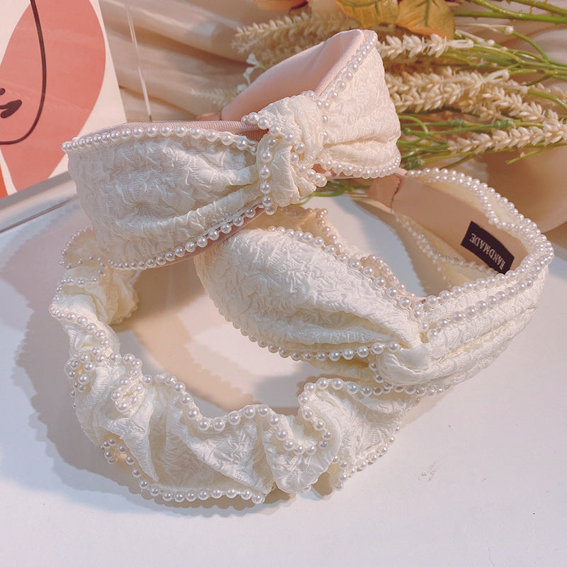 白色珍珠蝴蝶結髮箍－蝴蝶結款細節｜https://igowo.tw/